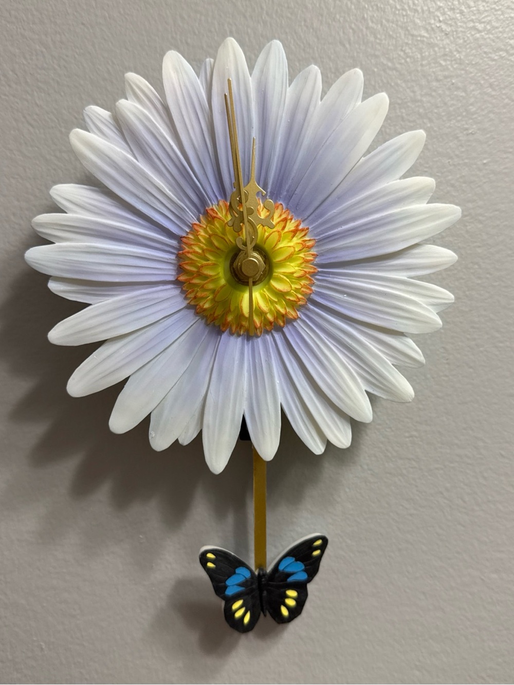 Daisy pendulum wall Clock with Butterfly Pendulum - blue and Yellow.  New in box